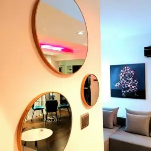 Round mirrors composition with wood colour frame