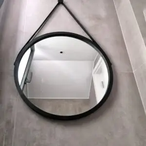 Round mirror with black leather hook