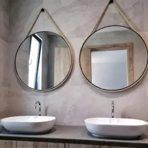 Round mirror with frame and rope