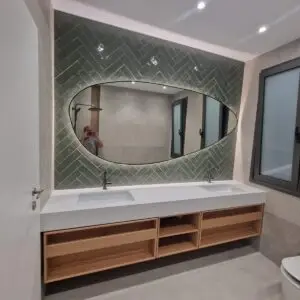 Irregular oval mirror with black frame and LED