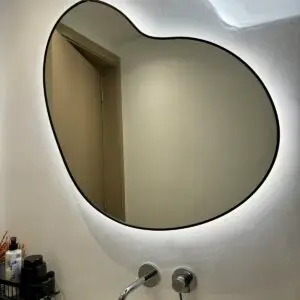 Irregular mirror with black frame