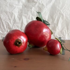 Pomegrantes in three sizes
